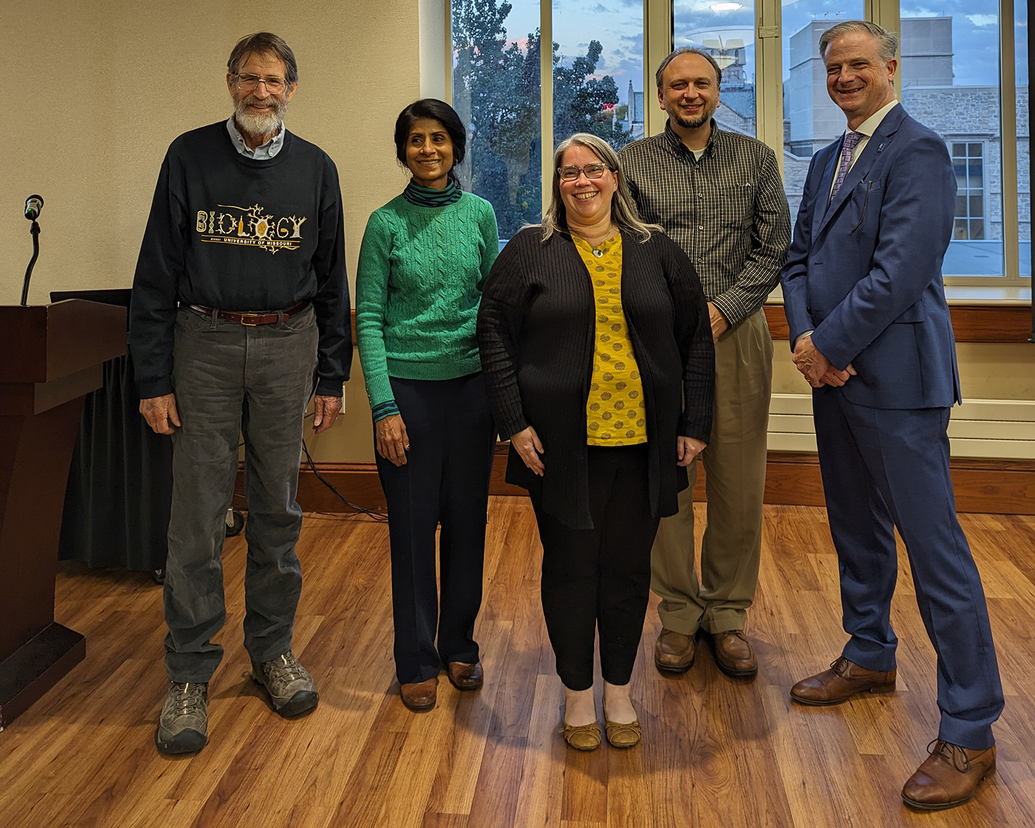 Dr. Brown standing with Dr. George Smith, Dr. Latha Ramchand, Dr. David Schulz, and Dr. Cooper Drury